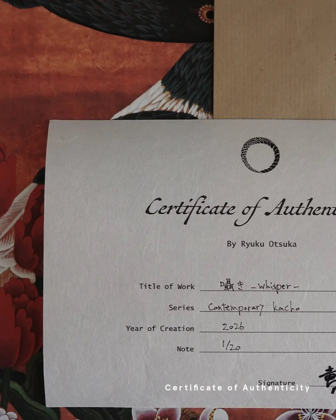 A close-up photograph of a Certificate of Authenticity printed on textured white washi paper for the fine art print "囁き - whisper -" by Ryuku Otsuka. The document specifies the series "Contemporary kacho," creation year 2026, limited edition numbering "1/20," and the artist's signature in Japanese kanji at the bottom right.