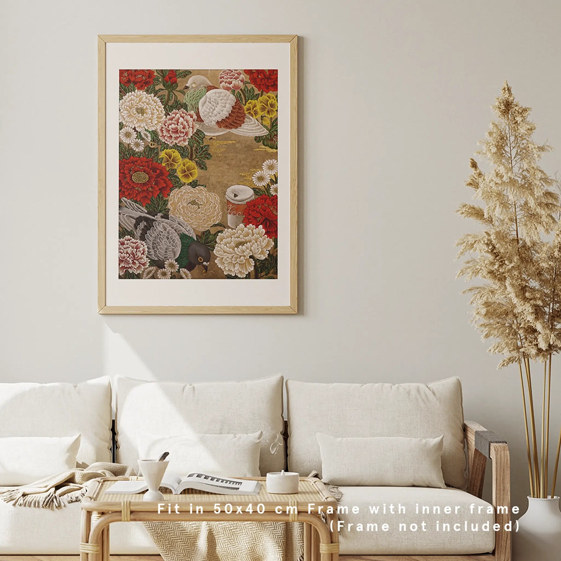 A framed 50x40 cm pigeon and floral art print hanging vertically above a neutral cream sofa in a bright, modern minimalist living room mockup.